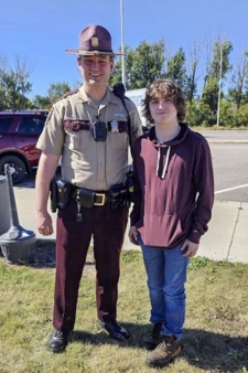 This image shows Zachary Gruver with the teenager whose life he saved